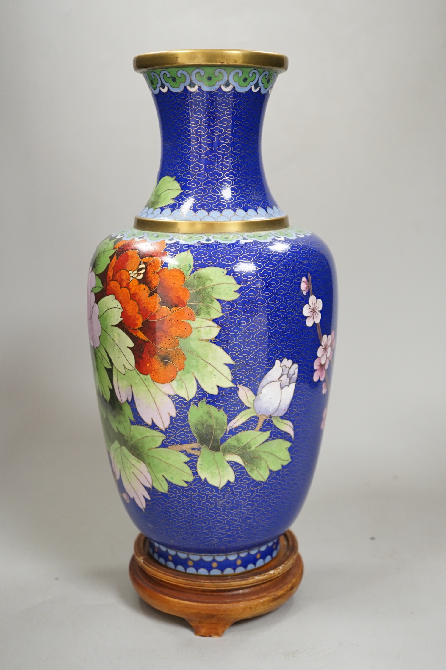 A Chinese cloisonné enamel vase on stand, 35cm high including stand